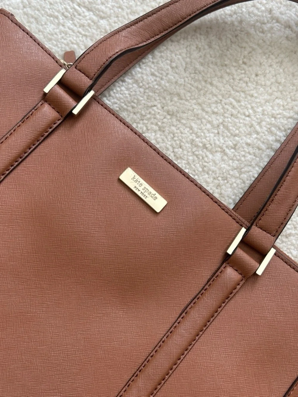 kate spade brown leather tote with gold-tone plaque